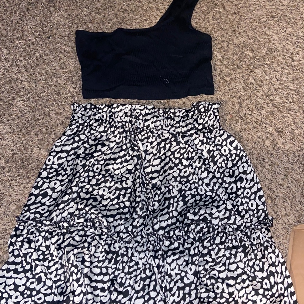 Two piece skirt and top. Off the shoulder top. Size medium, never worn